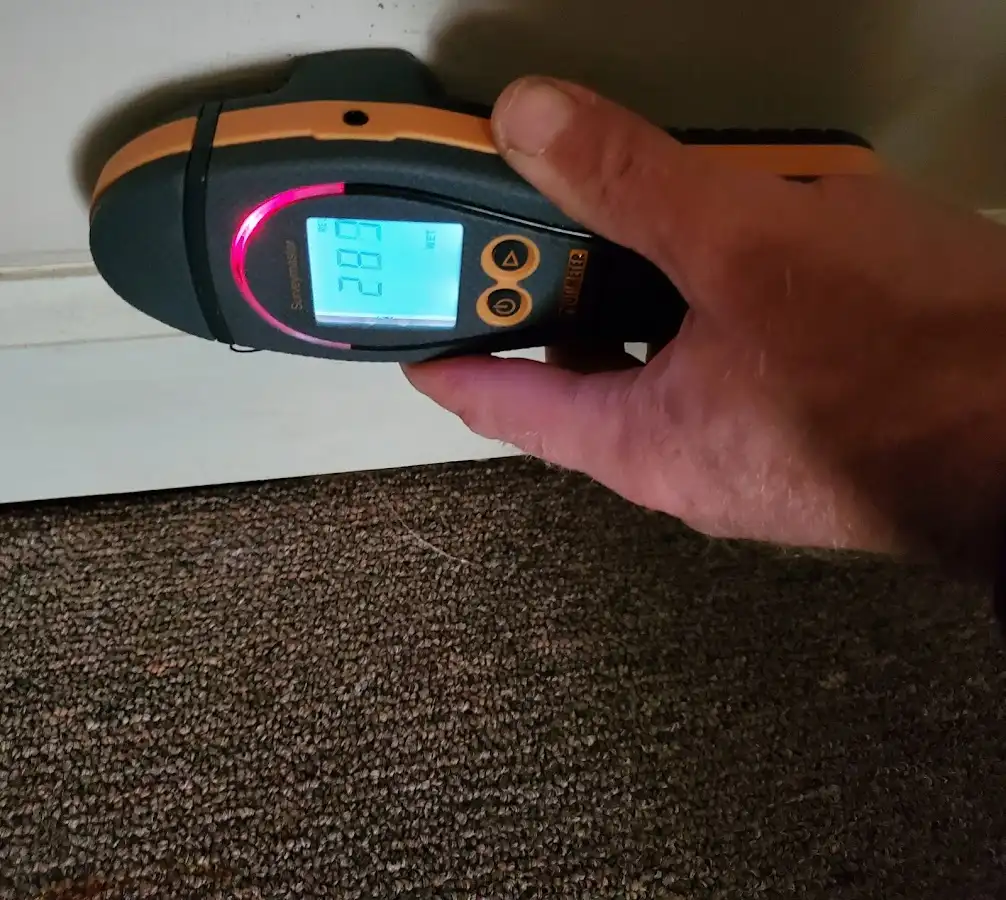 Moisture detection at baseboard during Storm Damage Restoration in Foxborough